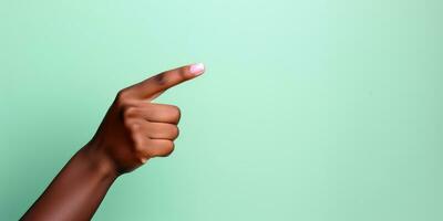 A womans hand pointing to the top in front of a pastel colored background.AI generative photo