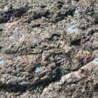 Photo realistic seamless texture pattern of granite stone walls in high resolution..