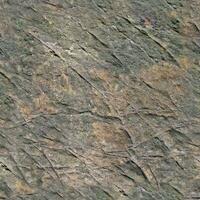 Photo realistic seamless texture pattern of granite stone walls in high resolution..