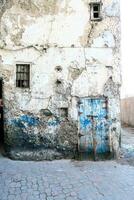 a building with old blue paint photo