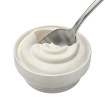 Bowl of sour cream in spoon isolated on white background, top view photo