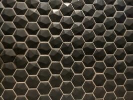 Texture of glossy black mosaic tiles hexagon photo