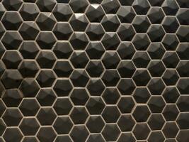 textura de lustroso negro mosaico losas hexágono foto