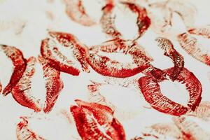 Lip prints of cosmetic lipstick on a light background photo