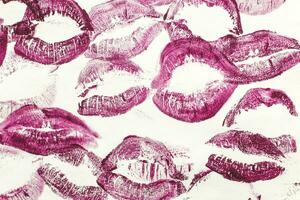 Lip prints of cosmetic lipstick on a light background photo