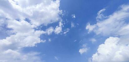 a blue sky with clouds and a blue sky, Blue sky and white cloud clear summer view, a large white cloud is in the sky, a blue sky with clouds and some white clouds photo