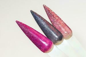Palette of nail designs, testers of multicolored polishes on flat nails photo