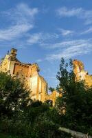 Old abandoned ruins of the factory on the background of the blue sky photo