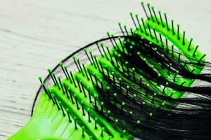 Alopecia hair loss concept, fallen hair on combs from disease. photo