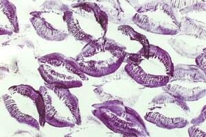 Lip prints of cosmetic lipstick on a light background photo