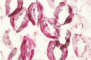 Lip prints of cosmetic lipstick on a light background photo