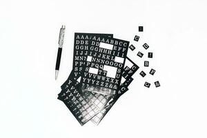 Stickers are white on a black background, letter symbols and punctuation marks photo