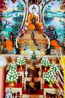 a buddhist shrine with a statue of buddha photo