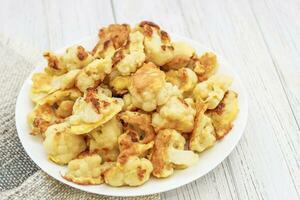 Vegetables Cauliflower fried in egg and flour batter photo