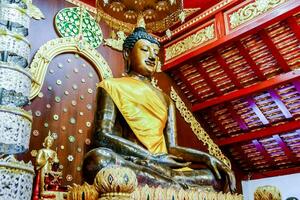 a large buddha statue in a temple photo