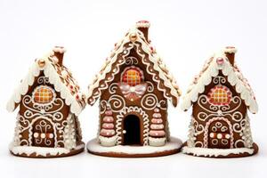 Stunning detailed chocolate gingerbread houses with candy adornments isolated on a white background photo