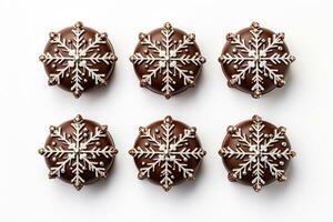 Festively detailed handcrafted chocolate snowflakes with glitter accents isolated on a white background photo