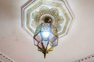 a decorative ceiling light with intricate designs photo