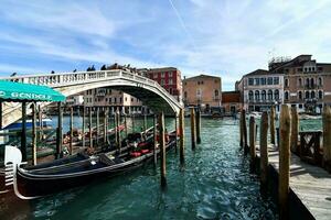 gondolas docked in the water photo