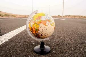 a globe on the road photo