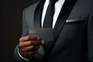 Businessman holding credit card on dark background, closeup. Online shopping. Generative AI photo