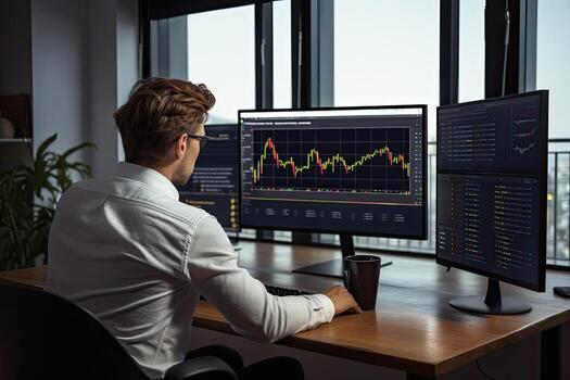 Back view of young businessman sitting at desk in office and looking at computer screen with stock market chart.  Generative AI photo
