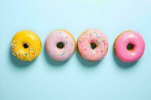 Photo of pink donats lined up in a row on blue background minimalism. High quality. AI Generative
