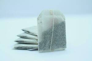 tea bag on white background, close up of tea bag. photo