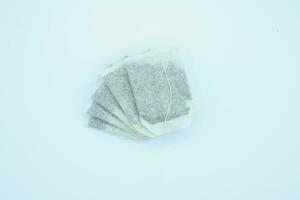 tea bag on white background, close up of tea bag. photo