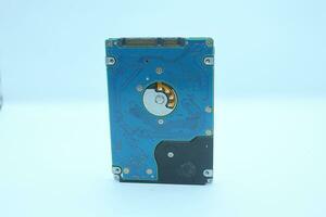 Hard disk drive isolated on a white background. Computer hardware technology. photo