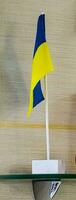 Flag of Ukraine on the background of the wall. Flag symbols of Ukraine. Close-up of the Ukrainian flag. photo