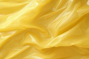 bright yellow plastic wrap overlay backdrop. crumpled and draped textured cellophane material photo