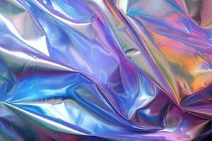 rainbow spilled gasoline plastic or foil wrap overlay backdrop. crumpled and draped textured cellophane material photo
