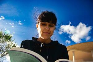 Woman reading book photo