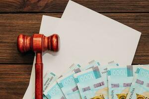 Ukrainian money hryvnias on the table with documents with a place for text. photo