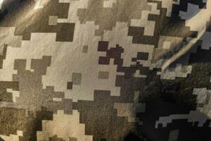 Texture close-up pixel camouflage military uniform of the Armed Forces photo