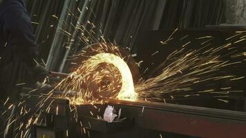 Cropped shot of a metalworker welding steel pipes with sparks flying video