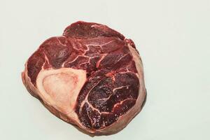 Fresh piece of meat big beef steak on the bone ossobuco. photo