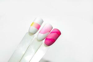 Palette of nail designs, testers of multicolored polishes on flat nails photo