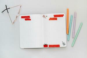 Filling in the diary, dotted notebook, colored tapes and stickers in the notebook photo