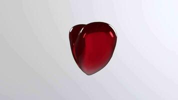 un' rosso cuore sagomato oggetto su un' bianca sfondo video
