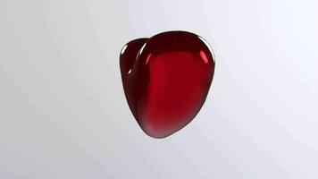 un rojo corazón conformado objeto en un blanco antecedentes video