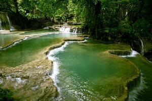 tad kuang si one of beautiful limestone waterfall in luangprabang one of most popular attraction in northern of lao photo