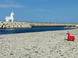 lighthouse red horse white Iho Tewoo jeju island photo