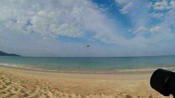 PHUKET, THAILAND FEBRUARY 18, 2023 Boeing 737 of Nok Air approaching to land at Phuket Airport. Passenger jet plane flies overhead. Wide angle shooting. Airliner descending over sea and beach video