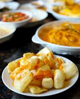 Rambak, jangek or kerupuk kulit is an Indonesian traditional crackers. It is made from the skin of cow, served with curry sauce - delicious and tasty photo