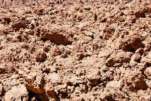 a large pile of dirt in the desert photo