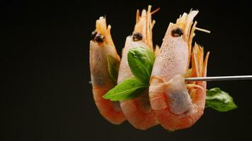 boiled shrimp with spices on black background video