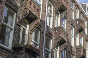 Picture of symetric house facade made of clinker bricks with balconies photo