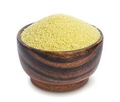 Couscous in wooden bowl isolated on white background photo